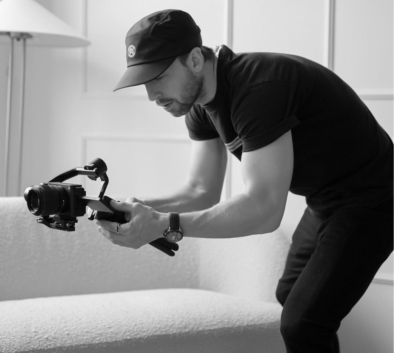 Founder filming with a gimbal-mounted camera in the studio