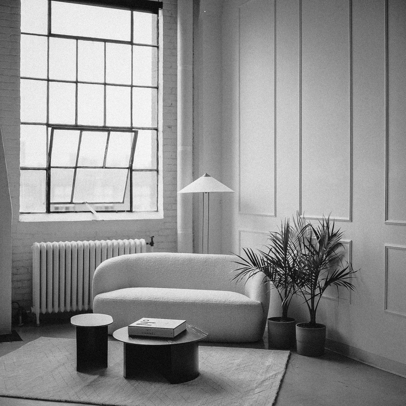 Bright production space with plants and seating
